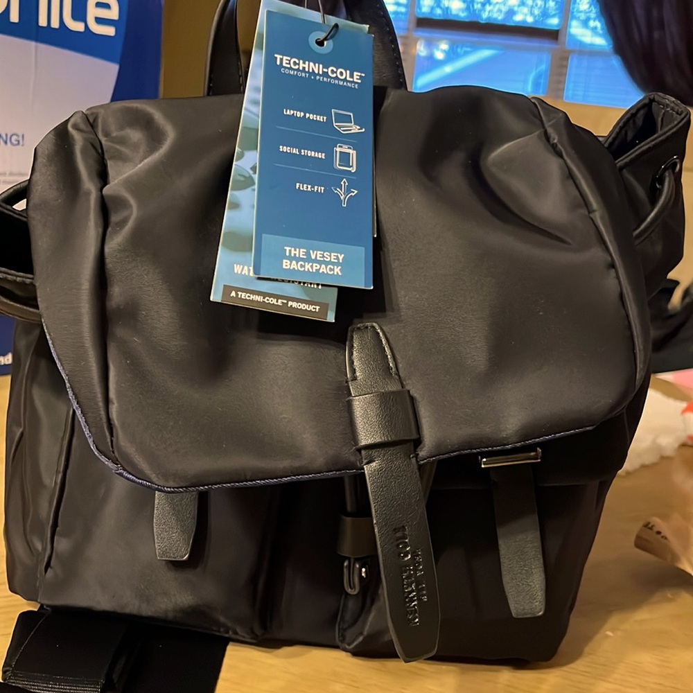 Back pack. Kenneth Cole   Water resistant